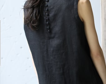 May include: A black sleeveless linen dress with a row of buttons down the back.