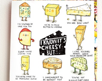 May include: A white greeting card featuring cartoon cheese characters with puns. The text "I KNOW IT'S CHEESY BUT..." is in the center. Other phrases include "I'VE STILTONS OF LOVE FOR YOU" and "YOU ARE BRIE-LIANT."