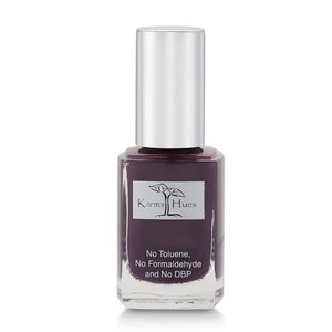 May include: A bottle of Karma Hues nail polish in a deep purple shade. The bottle is labeled with the brand name and the words "No Toluene, No Formaldehyde and No DBP".