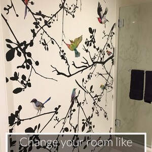 May include: A white wall with a black and white silhouette of branches and birds. The text "Change your room like my customer did!" is at the bottom of the image.