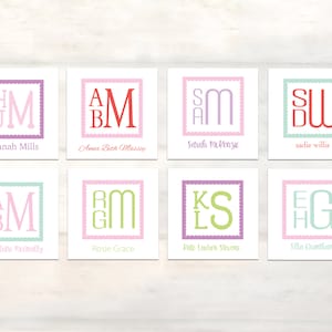 May include: Eight square cards with personalized monogram designs. Each card features a unique combination of letters in various colors, such as pink, green, and purple, within a decorative border. Names are printed below the initials.