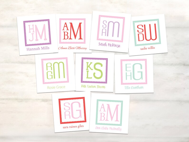 May include: A collection of personalized cards with initial monograms. Each card features a unique combination of letters within a square frame, with names printed below. The color palette includes pink, green, purple, and red.