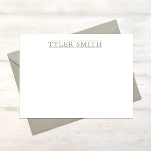 May include: A white stationery card with a gray envelope. The card has the name "TYLER SMITH" printed in gray at the top.