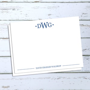 May include: White stationery with a blue monogram "DWG" and the name "Davis Graham Waldrop" printed below.