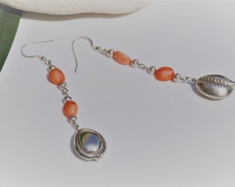 Earrings long silver cowrie, coral Nuggets and silver beads. Dangling ideal length for your face.