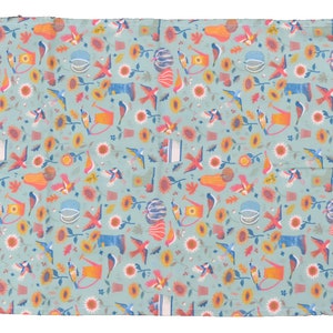 May include: A teal blue fabric with a repeating pattern of colorful birds, sunflowers, pumpkins, watering cans, and other fall-themed elements.