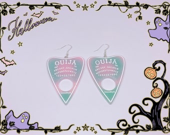 Pastel goth pink and blue resin Ouija board earrings for Halloween and Gothic fashion