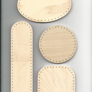 May include: Four wooden shapes with holes around the edges. The shapes are a large oval, a smaller oval, a rectangle, and a long, thin rectangle.