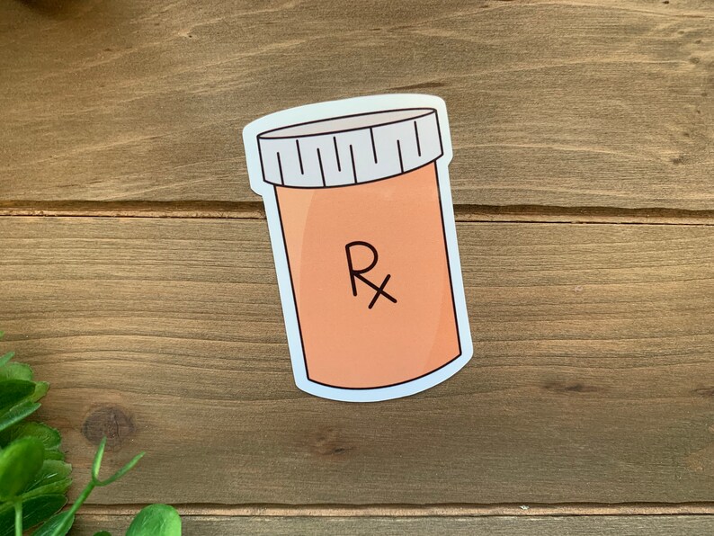 May include: A white sticker with a cartoon illustration of a pill bottle with a white lid and the letter "Rx" on the label.
