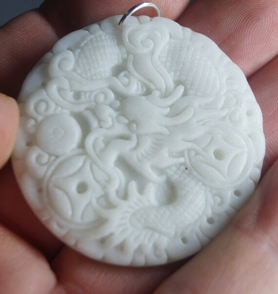 White jadeite dragon carved pendant. Crown chakra