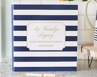 Könnte beinhalten: Ein blaues und weiß gestreiftes Hardcover-Buch mit goldener Aufschrift "My Family's Legacy Estate Organization Workbook A Gift of Love".