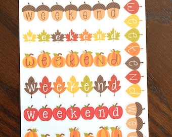 May include: A sheet of stickers with the word "weekend" repeated multiple times. Each "weekend" is decorated with different fall-themed designs, including acorns, leaves, and pumpkins. The text "Peanut Butter Taco" is at the top of the sheet.