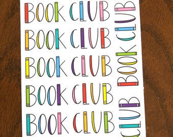 May include: Seven colorful stickers with the text "BOOK CLUB" in black. Each sticker features a stack of colorful books with a small heart on the top.