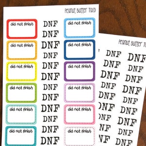 May include: A sheet of stickers with the text "DNF" and "did not finish" in black text on a white background. The stickers are in various colors, including red, orange, yellow, green, blue, purple, and pink.