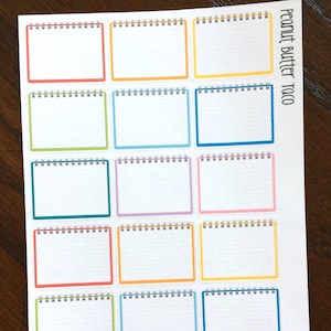 May include: A sheet of 12 colorful notepad stickers with a  "Peanut Butter Taco" title. Each sticker has a white background with a lined pattern and a different colored border.