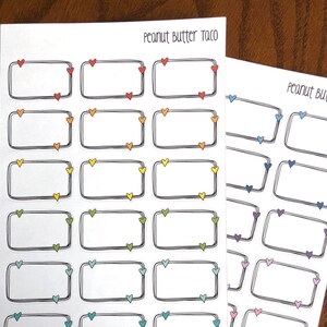 May include: Two sheets of sticker paper with rectangular labels with hearts in the corners. The labels are in different colors, including red, orange, yellow, green, blue, purple, and pink. The text "Peanut Butter Taco" is at the top of the first sheet.