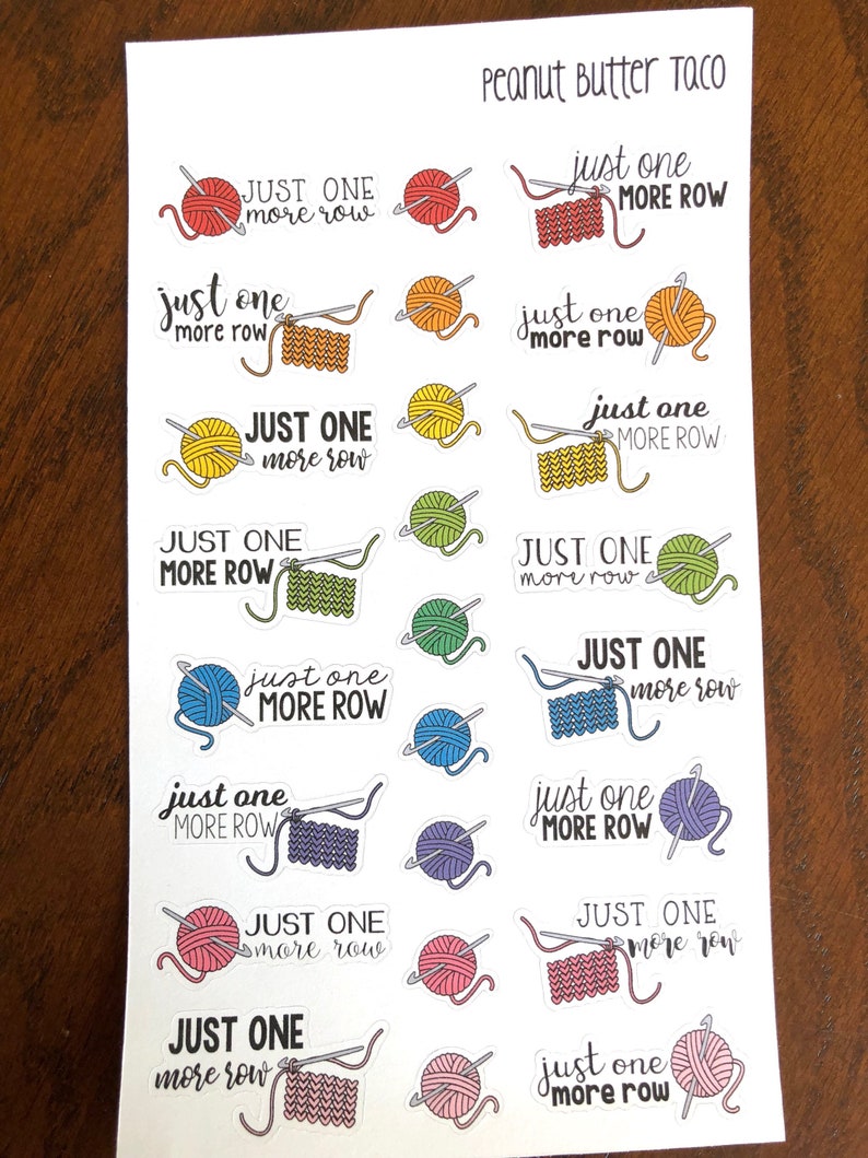 May include: A sheet of colorful stickers with a knitting theme. Each sticker features a ball of yarn, knitting needles, and the text "Just One More Row". The stickers are arranged in a grid pattern on a white background. The text "Peanut Butter Taco" is printed at the top of the sheet.