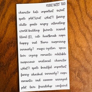 May include: A white sheet of paper with black text listing various words and phrases related to book reviews, such as "character", "plot twist", "funny", "love", "crying", "romantic", "suspicious", "emotional", "beautiful", "important", "shocked", "annoyed", "friendship", and "confused". The text is handwritten in a casual, cursive style. The title "Peanut Butter Taco" is at the top of the page.