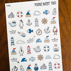 May include: Sheet of nautical-themed stickers featuring boats, anchors, lighthouses, whales, seagulls, and life preservers. The stickers are in shades of blue, red, and white, with the text "Peanut Butter Taco" at the top.