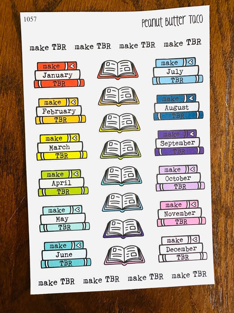 May include: A set of 12 colorful book stack stickers with the text "make TBR" and the months of the year. The stickers are perfect for organizing your to-be-read list.