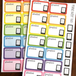 May include: A set of colorful stickers with a Kindle e-reader design. The stickers are labeled "started" and "finished" and are perfect for tracking reading progress. The stickers are printed with a peanut butter and taco theme.