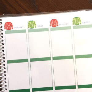 May include: A weekly planner with green and white squares and red and green Christmas sweater stickers with numbers 15, 16, 17, and 18. The days of the week are labeled Thursday, Friday, Saturday, and Sunday.