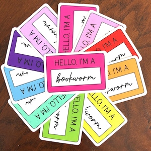 May include: A set of ten colorful stickers with the text "HELLO. I'M A" and a blank space for a word. One sticker has the word "bookworm" filled in.