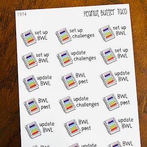 May include: A sheet of stickers with small, colourful book illustrations. The stickers feature text such as "set up BWL", "update challenges", and "BWL post". Each book has a rainbow spine and the word "BOOKWORM". The sheet is labelled "Peanut Butter Taco".
