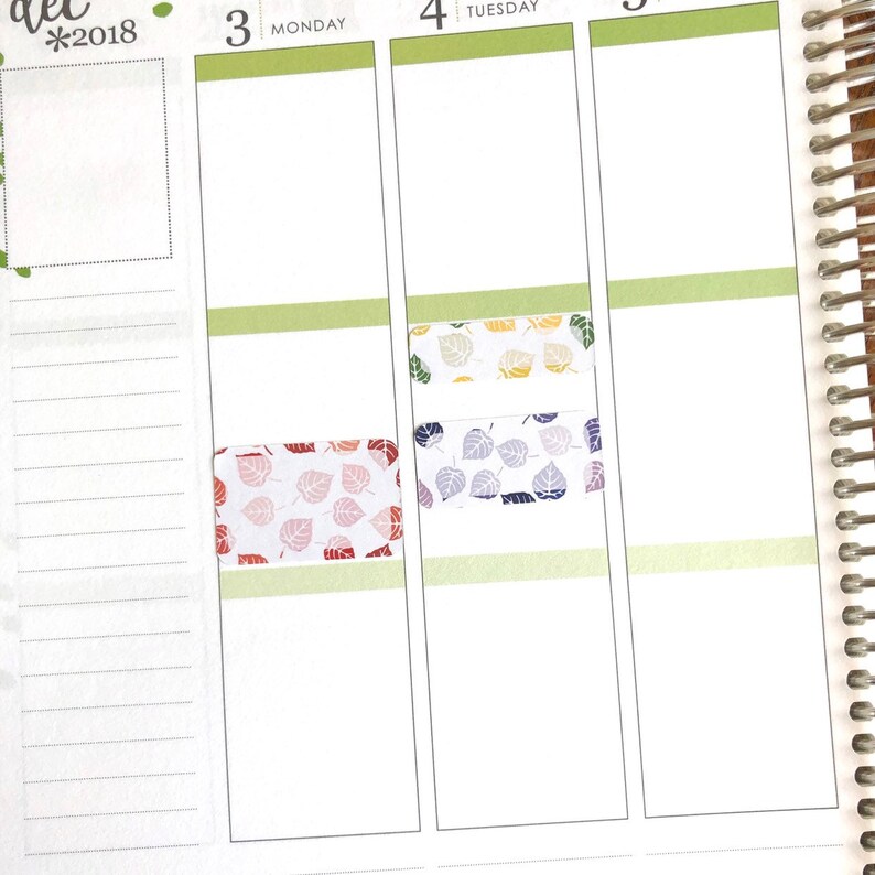 May include: A weekly planner with a green, yellow, and purple leaf pattern sticker on the Monday, Tuesday, and Wednesday sections. The planner is dated December 2018.