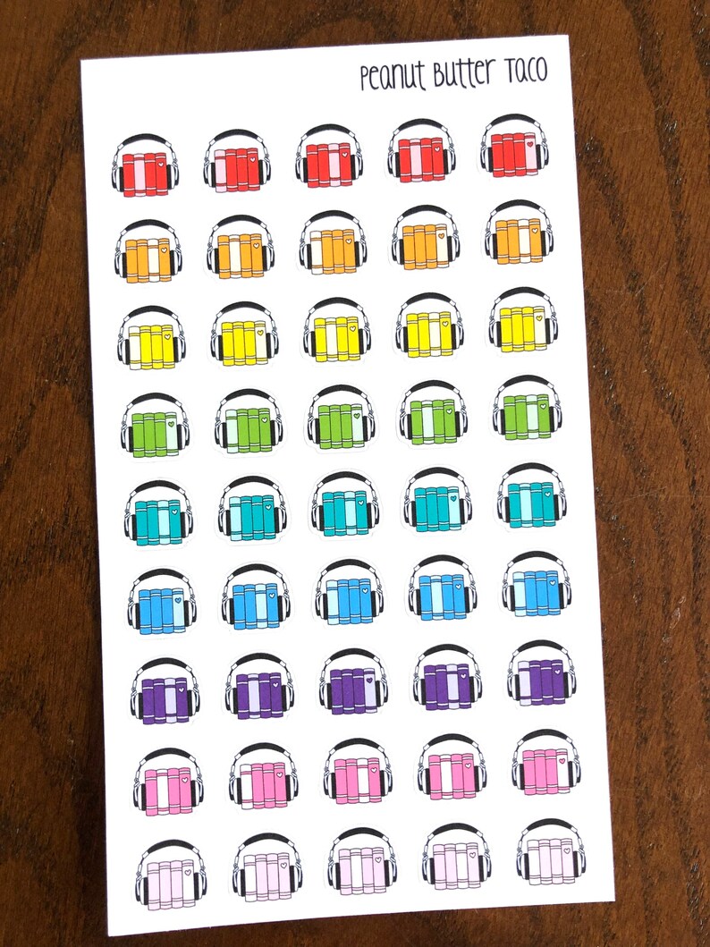 May include: A sheet of 40 colorful stickers featuring a stack of books with headphones on top. The stickers are arranged in 8 rows of 5 stickers each. The colors of the stickers are red, orange, yellow, green, blue, purple, pink, and white.