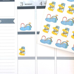 May include: A sheet of planner stickers featuring a pool with a rainbow and umbrella, and a yellow table with a blue chair. The stickers are on a white background with a planner page visible.