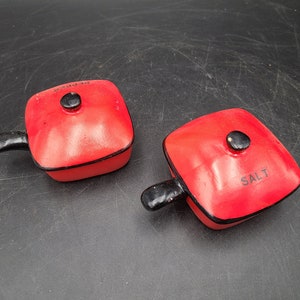 Pair of red handled pan salt and pepper shakers 4&quot; long