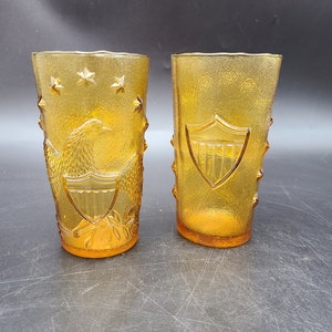 Pair Italian amber glass Tumblers with Eagle and Shield embossed
