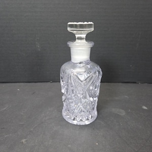Antique Pressed glass Imperial Cologne or perfume bottle ground stopper star pattern Purple TINT