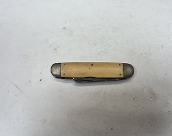 Very old antique Pocket knife yellow handle bakelite?