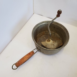 Antique Foley food mill with red wood handles