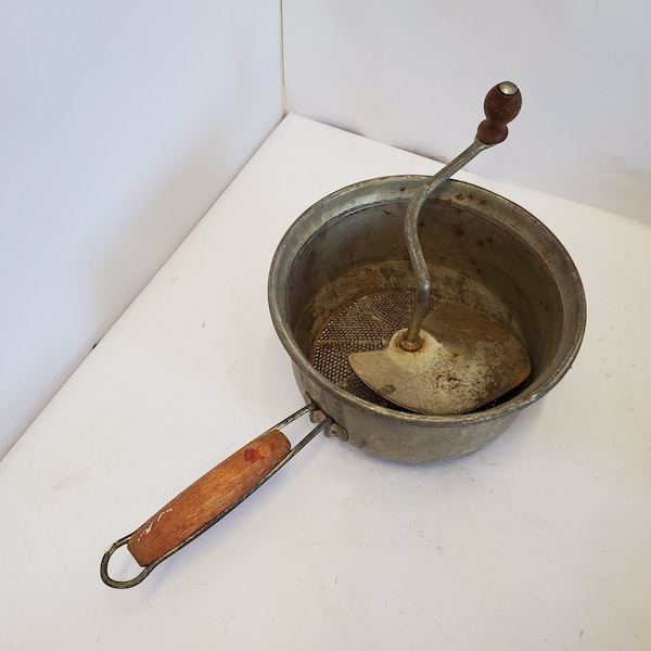 Antique Foley food mill with red wood handles