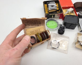 Collection of various camera parts Filters rangefinder light exposure meter lens