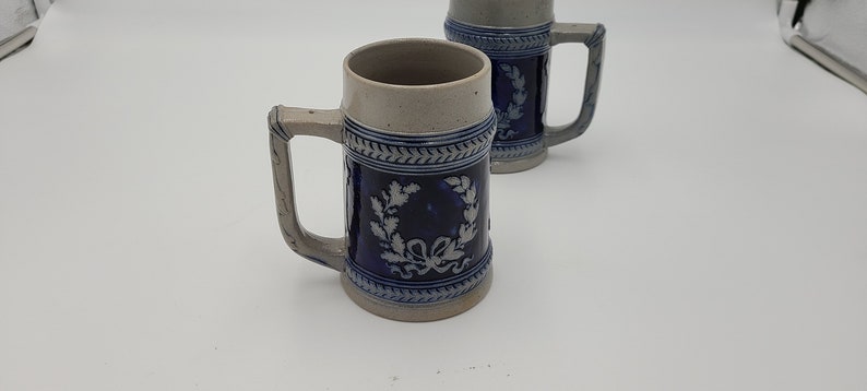 Matched pair of Cobalt blue Wreath pattern Beer steins Germany .4l