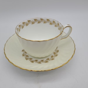 Minton Vineyard Yellow scalloped Tea cup and saucer