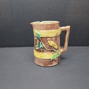 Antique Majolica pottery Small pitcher creamer canary on a branch chipped