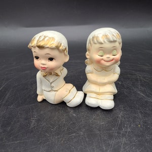 Boy and girl pair ensenco Salt and pepper shakers 3"