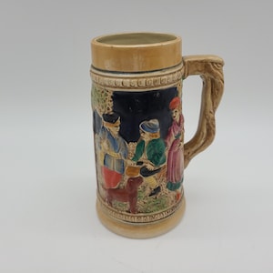 Vintage beer Stein people drinking and water wheel stream scene