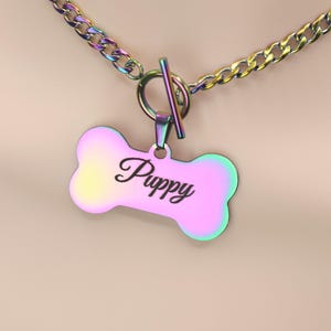 May include: A rainbow iridescent dog collar with a bone-shaped tag that says "Puppy".