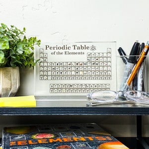 Lucite acrylic-encased periodic table featuring 85 genuine elements, ideal for educational and decorative purposes.