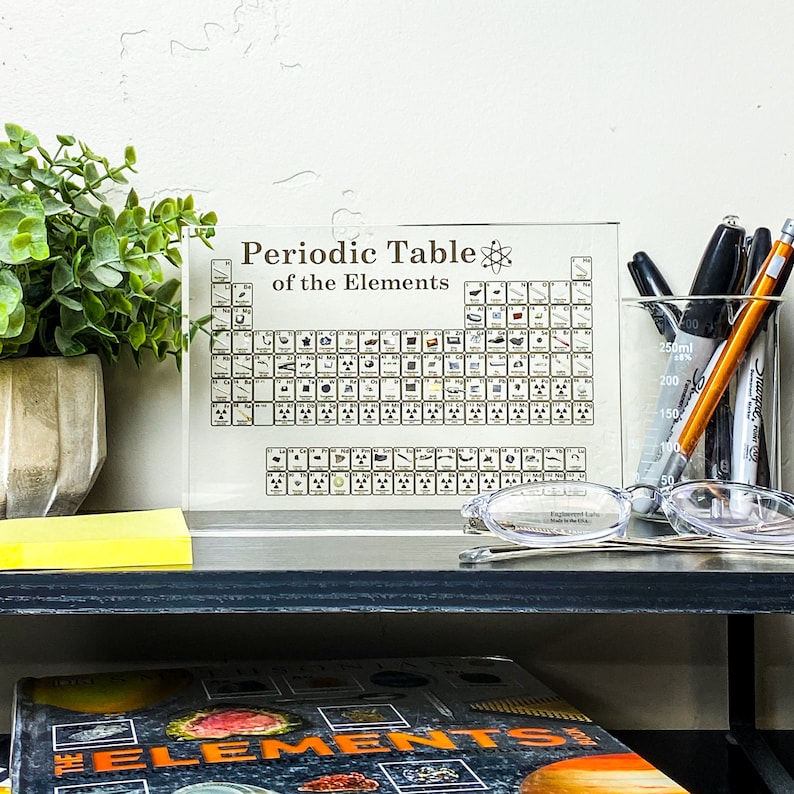 Lucite acrylic-encased periodic table featuring 85 genuine elements, ideal for educational and decorative purposes.