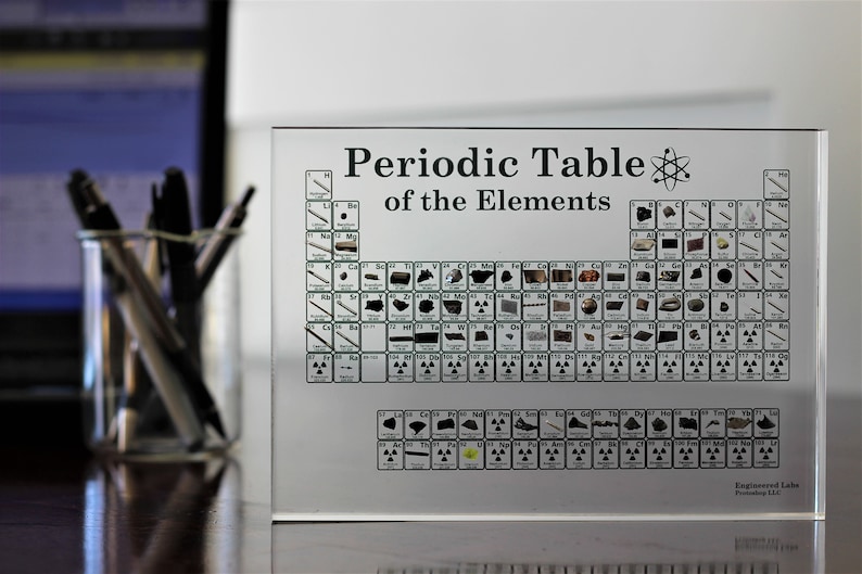Bring science to life with a lucite acrylic-encased periodic table, housing 85 genuine elements for an educational and decorative centerpiece.