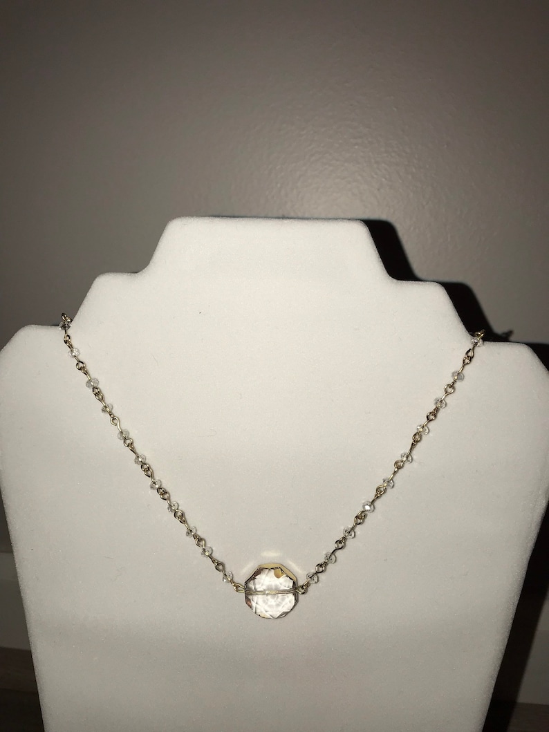 Clear glass beas necklace w circular crystal