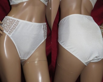 May include: White satin underwear with lace trim. The underwear has a high leg cut and a low rise waist.