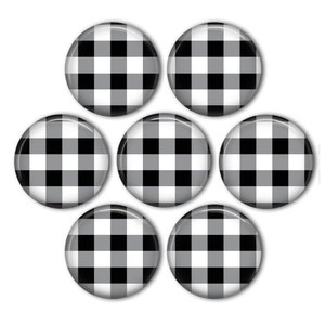 May include: Seven round black and white gingham patterned buttons.